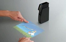проектор light touch превращает любую плоскую поверхность в сенсорный экран